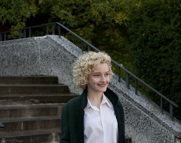 A young woman walking outside
